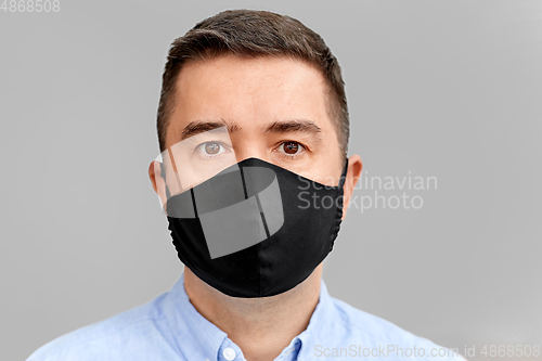 Image of middle-aged man in reusable face protective mask