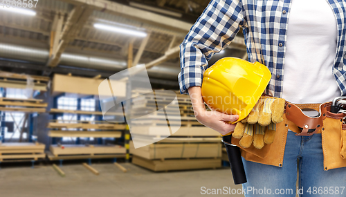 Image of woman or worker with helmet and working tools