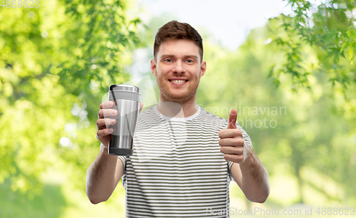 Image of man with thermo cup or tumbler for hot drinks