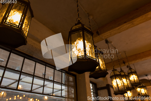 Image of lantern lamps hanging at restaurant