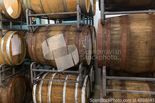 Image of wooden barrels at craft brewery or winery