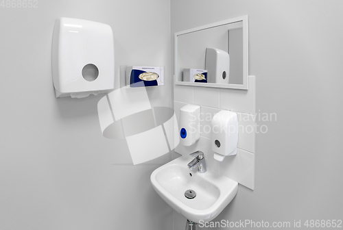 Image of hospital bathroom with sink, soap and paper towels
