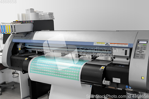 Image of large format printer in printing house