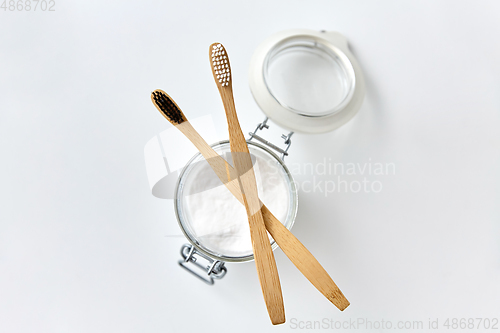 Image of washing soda and wooden toothbrushes