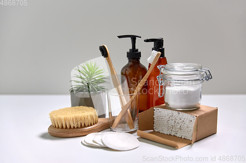 Image of wooden toothbrush, cotton pads and swabs in box