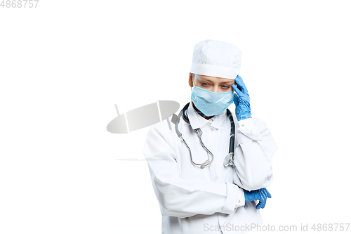 Image of Female young doctor with stethoscope and face mask isolated on white studio background