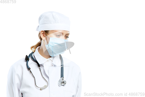 Image of Female young doctor with stethoscope and face mask isolated on white studio background