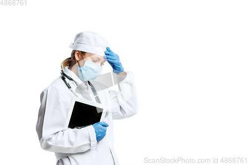 Image of Female young doctor with stethoscope and face mask isolated on white studio background