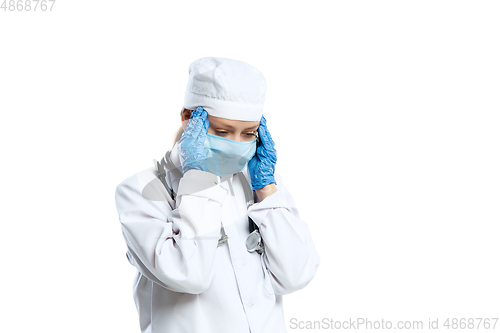 Image of Female young doctor with stethoscope and face mask isolated on white studio background