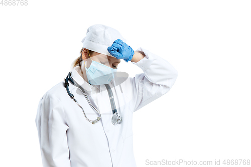 Image of Female young doctor with stethoscope and face mask isolated on white studio background