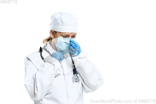 Image of Female young doctor with stethoscope and face mask isolated on white studio background