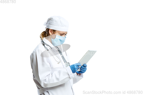 Image of Female young doctor with stethoscope and face mask isolated on white studio background