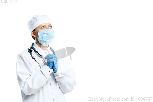 Image of Female young doctor with stethoscope and face mask isolated on white studio background