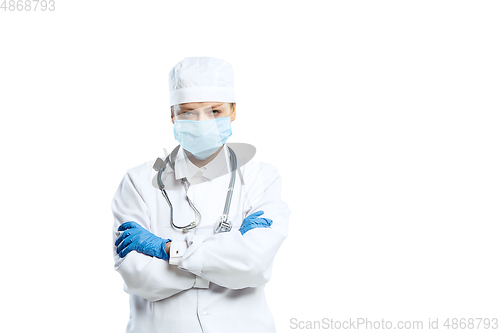 Image of Female young doctor with stethoscope and face mask isolated on white studio background