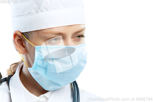 Image of Female young doctor with stethoscope and face mask isolated on white studio background