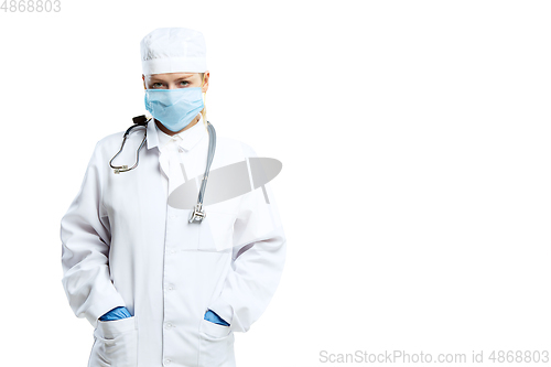 Image of Female young doctor with stethoscope and face mask isolated on white studio background