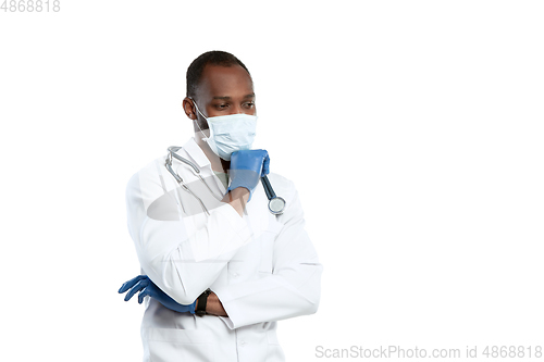 Image of Male young doctor with stethoscope and face mask isolated on white studio background