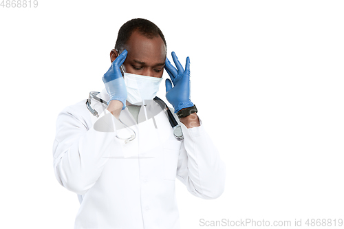 Image of Male young doctor with stethoscope and face mask isolated on white studio background