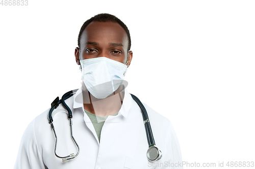 Image of Male young doctor with stethoscope and face mask isolated on white studio background