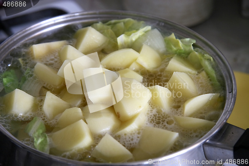 Image of vegetables boiling in a pan