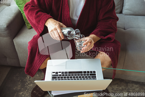 Image of Mature senior older man during quarantine, realizing how important stay at home during virus outbreak, close up