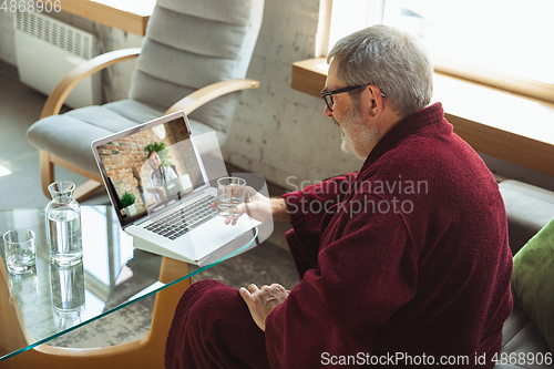 Image of Mature senior older man during quarantine, realizing how important stay at home during virus outbreak