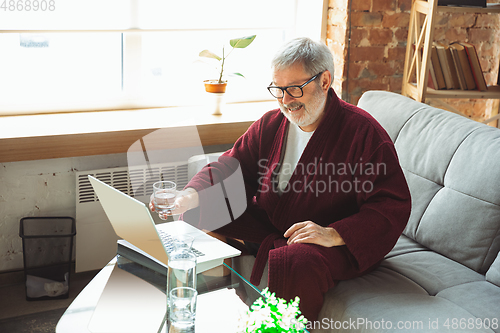 Image of Mature senior older man during quarantine, realizing how important stay at home during virus outbreak