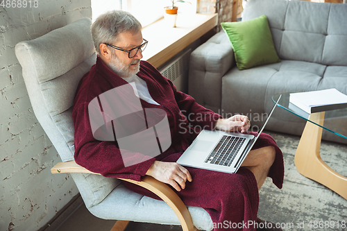 Image of Mature senior older man during quarantine, realizing how important stay at home during virus outbreak