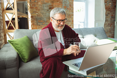 Image of Mature senior older man during quarantine, realizing how important stay at home during virus outbreak