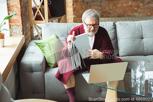 Image of Mature senior older man during quarantine, realizing how important stay at home during virus outbreak