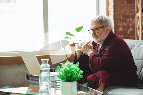 Image of Mature senior older man during quarantine, realizing how important stay at home during virus outbreak