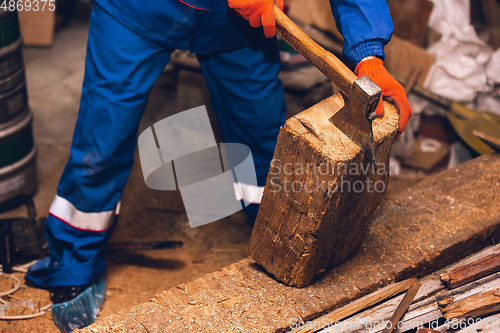 Image of Close up of hands of repairman, professional builder working outdoors, repairing