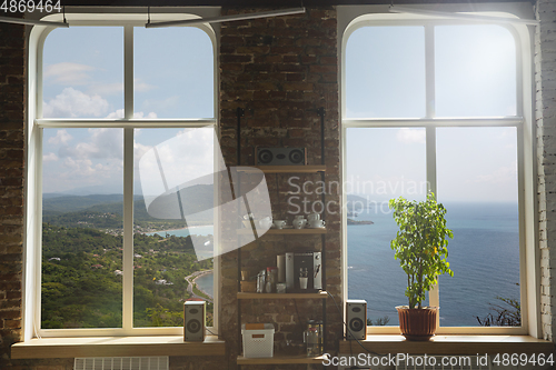 Image of Closed window and beautiful picture outside, nature view, resort and resting