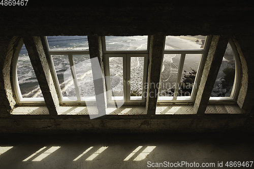 Image of Closed window and beautiful picture outside, nature view, resort and resting