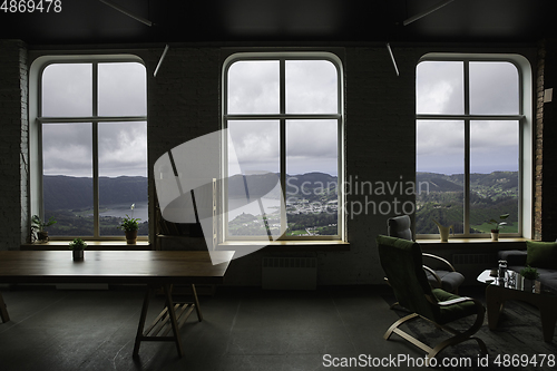 Image of Closed window and beautiful picture outside, nature view, resort and resting