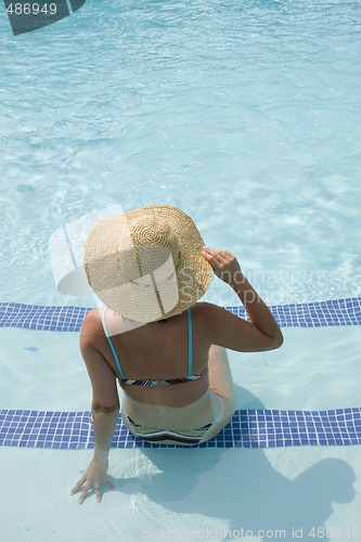 Image of woman relaxing in the pool