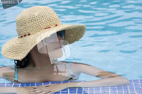 Image of woman relaxing in the pool