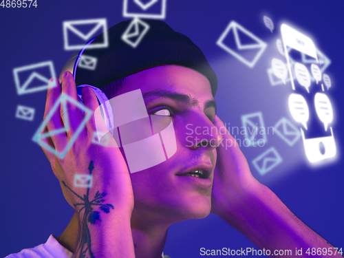 Image of Man using interface modern technology and digital layer effect for social media displaying, music listening, talking