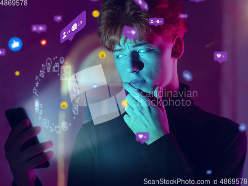 Image of Man using interface modern technology and digital layer effect for social media displaying