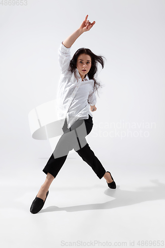Image of Young and graceful ballet dancer in minimal black style isolated on white studio background