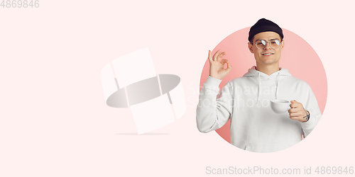 Image of Portrait of young man on bright bicolor background with geometric style, modern design, artwork. Flyer with copyspace.