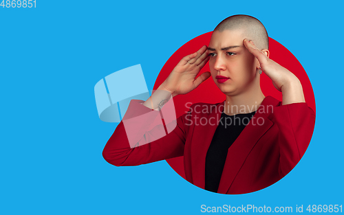 Image of Portrait of young woman with freaky appearance on bright bicolor background with geometric style