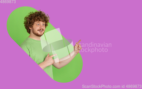 Image of Portrait of young man on bright bicolor background with geometric style, modern design, artwork