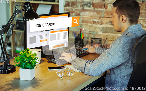 Image of Man looking for a job during worldwide crisis. Find a job online. Business, internet and networking concept. Modern search bar design.