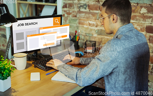 Image of Man looking for a job during worldwide crisis. Find a job online. Business, internet and networking concept. Modern search bar design.