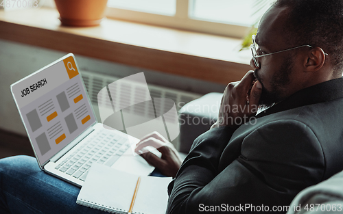 Image of Man looking for a job during worldwide crisis of coronavirus pandemic. Find a job online. Business, internet and networking concept.