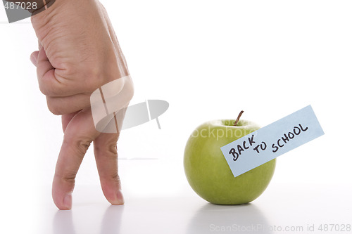 Image of hand with walking fingers going to school