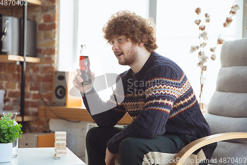 Image of Portrait of millenial boy with retro style, meeting things from the past and having fun, nostalgic the lifestyle of the nineties