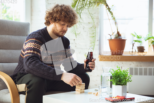 Image of Portrait of millenial boy with retro style, meeting things from the past and having fun, nostalgic the lifestyle of the nineties