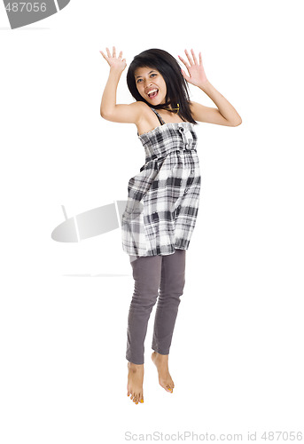 Image of Young asian girl jumping for joy